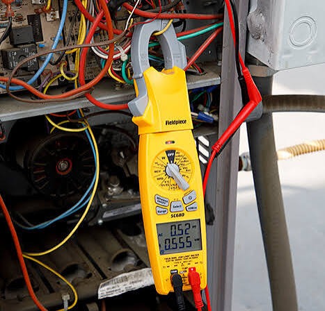 Clamp meter used to check HVAC electrical components